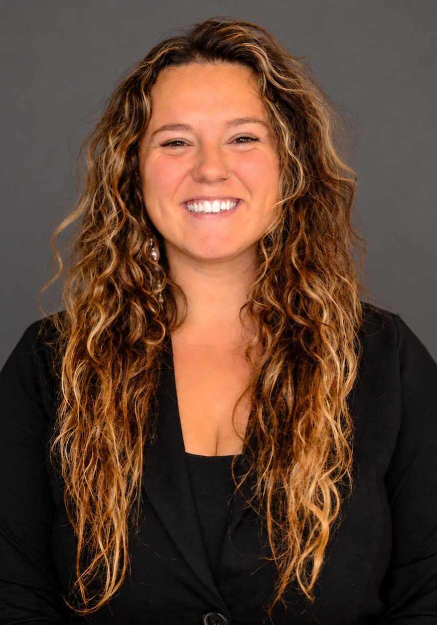 Warm Professional Curly-Haired Headshot